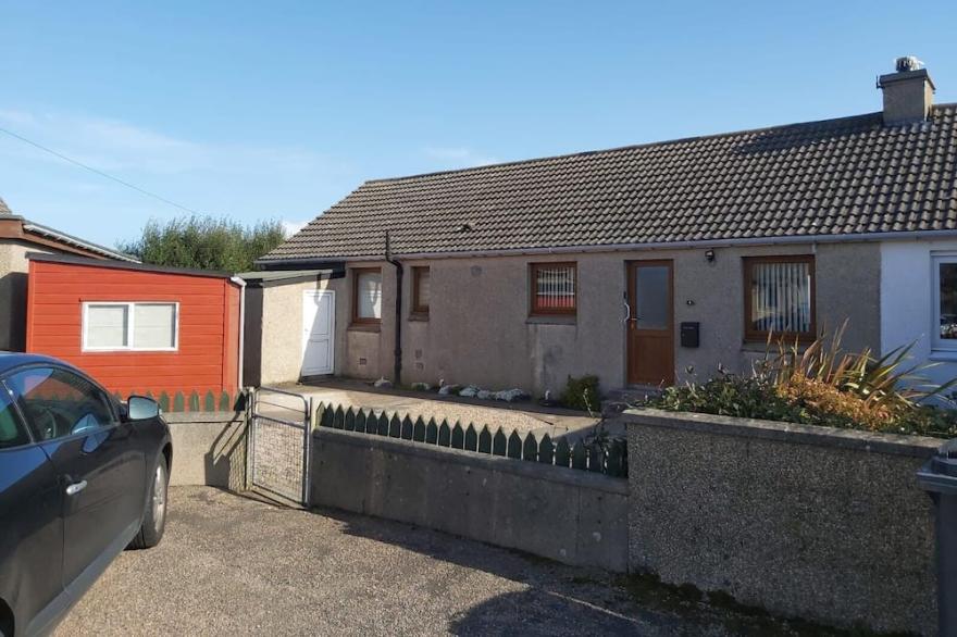 Bungalow with sea-view, near small town of Thurso.