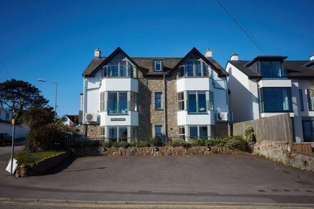 A two-bedroom modern and sleek apartment with sea views and an outdoor terrace.