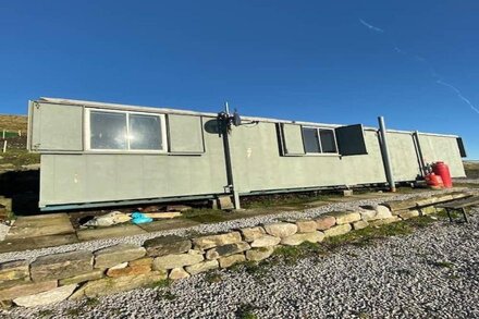 Converted container cabin set in a 40 acre farm with stunning panoramic views