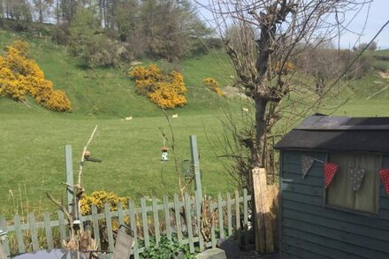 A stone built two bedroom cottage in the Snowdonia area overlooking a river.