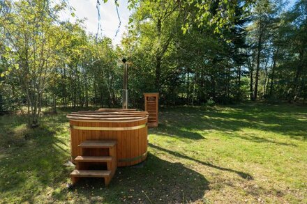 Secluded woodland cottage on the banks of a pristine Highland river