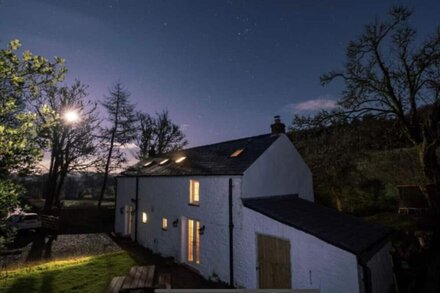 Holiday Cottage with luxury hot tub sat in its own private woodland in Brecon.