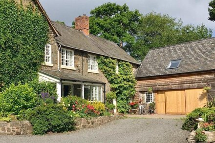 Charming Welsh Farmhouse, natural swimming pool, fabulous views, sleeps to 14