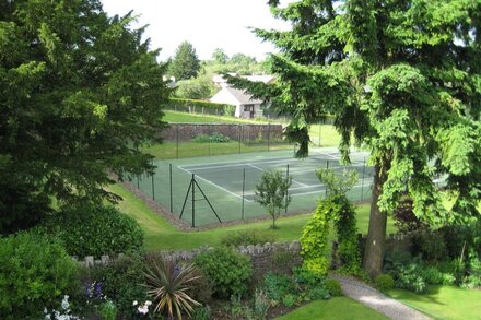 Holiday cottage with use of owners' swimming pool and tennis court