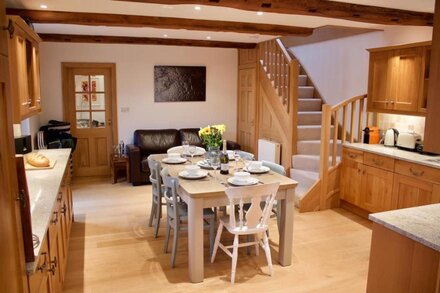 The Old Stables in South Devon with private decking, overlooking Start Bay