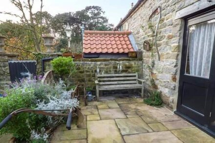 THE HAYLOFT, character holiday cottage, with a garden in Cloughton