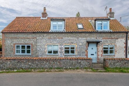 A splendid fully refurbished detached 17th century country cottage, with wonderful views across undu