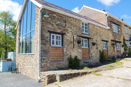 THE BARN AT GLANOER, pet friendly, with open fire in Hundred House