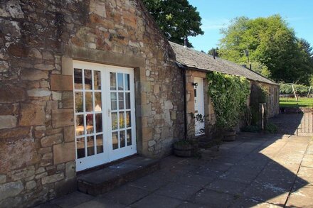 The Steading cottage with large gardens, south-facing patio with great views!