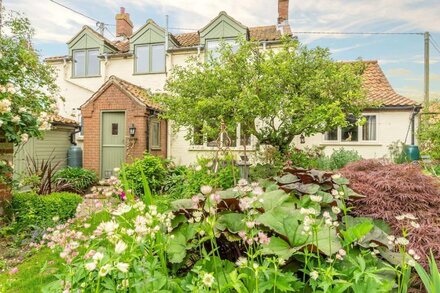 A very attractive detached character house, with pretty cottage garden.