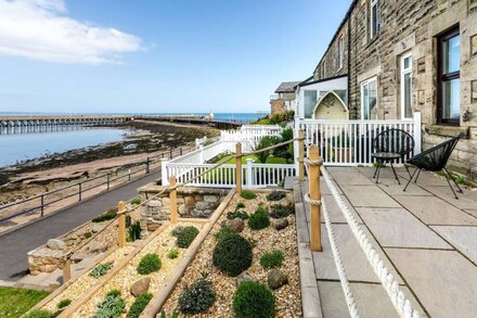 OLD COASTGUARD COTTAGES, pet friendly, with open fire in Amble