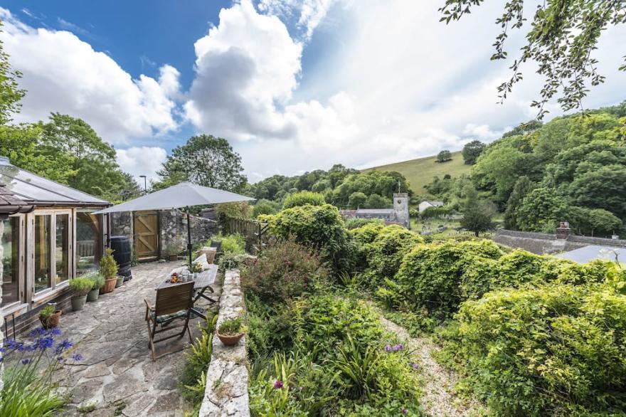 A charming detached stone cottage situated on an elevated site above Upwey.