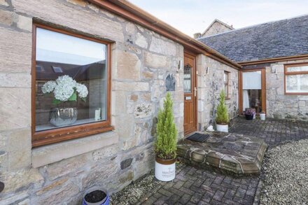 THE KIRKLANDS COTTAGE, with a garden in Eaglesham, Glasgow