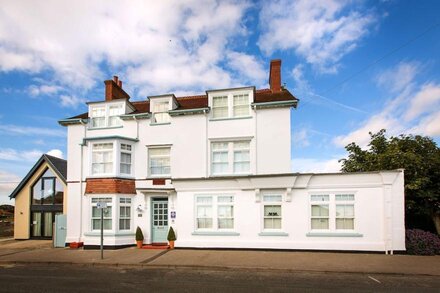 Beach House Mundesley, overlooking the beach sleeps 16 in 7 bedrooms