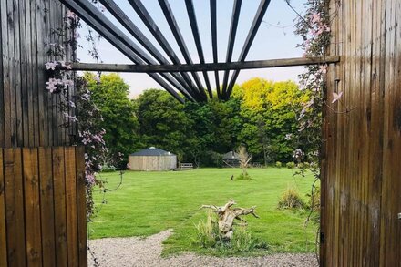 Apothecary yurt, a herbal retreat in field and woodland surroundings