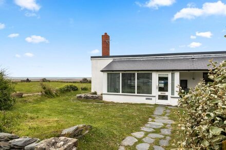 A peaceful, waterside cottage set on the old harbour wall on The Parrog, Newport, Pembrokeshire