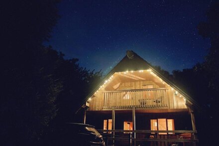 A cosy log cabin  nestled in the woods. next to the river Deveron