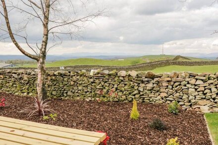 HOWGILLS RETREAT, pet friendly, with open fire in Kirkby Lonsdale