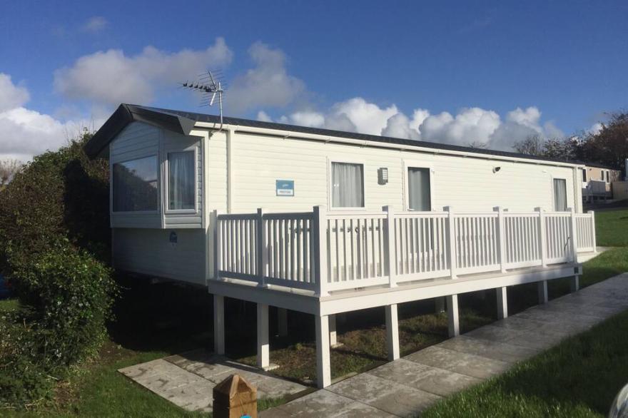 Modern 2 bedroom caravan.  Disabled friendly with wetroom & fab sun deck.