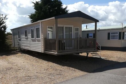 This caravan has a covered and fenced veranda