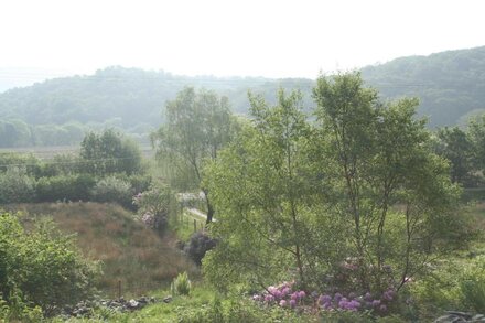 Caravan own private garden. lit car park, secluded open aspect, Mountain views.