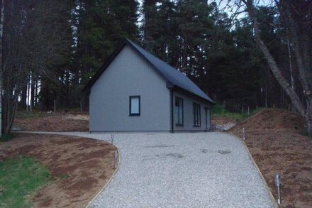 Sawmill Cottage, set in Woodland Beside the River Spey