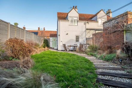 Pretty white-washed three bedroom cottage with distant marsh views