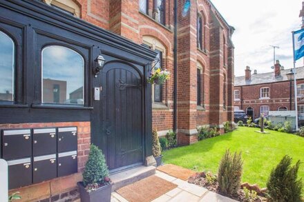 Luxury chapel apartment within Chester city walls, with parking.