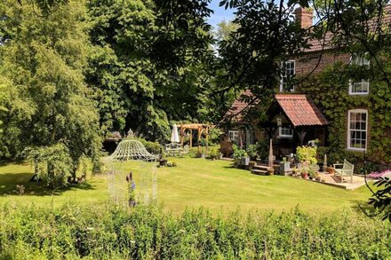 Riverside cottage in pretty gardens near Langrick, Boston.