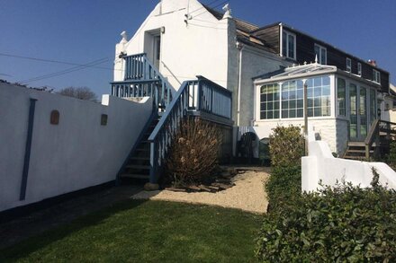 Beachside holiday home, extensive sea views, private garden and parking