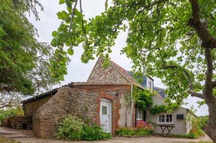 A picturesque country cottage, over 200 years old, in an idyllic rural position.