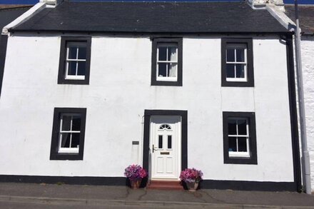 This lovely 18thC harbour cottage has spectacular views both front and rear.