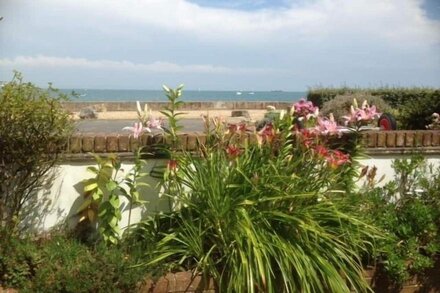 Charming seafront  home with garden on the Beach in unspoilt Seaside Village