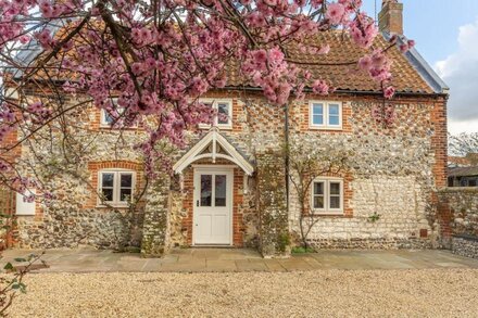 A super brick and flint detached property that has been beautifully extended.