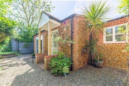 A contemporary four-bedroom cottage situated a short walk to Holme Beach.