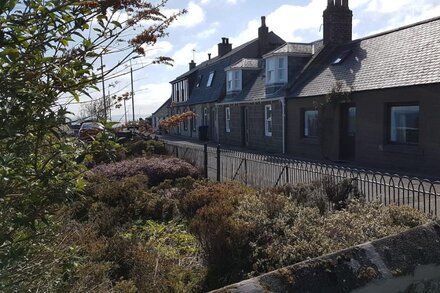 Myrtle Cottage  set in an elevated location with spectacular sea views.