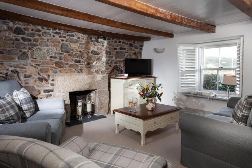 Just a stone's throw away from the water's edge, thatched Trevarrow Cottage is the ideal place to un