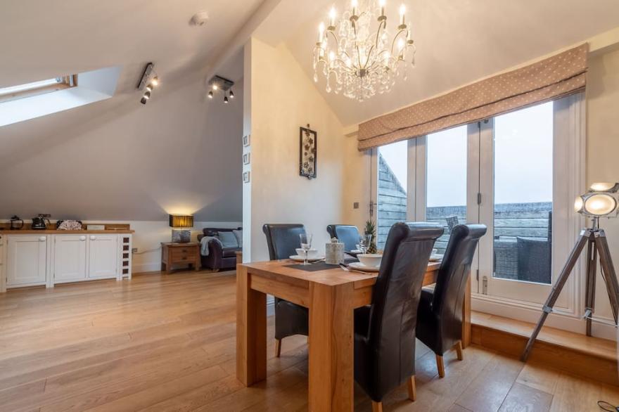 A luxury two bedroom apartment with breathtaking sea views across Carbis Bay.