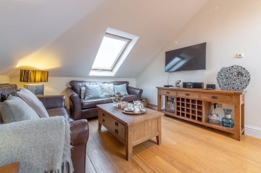 A luxury two bedroom apartment with breathtaking sea views across Carbis Bay.