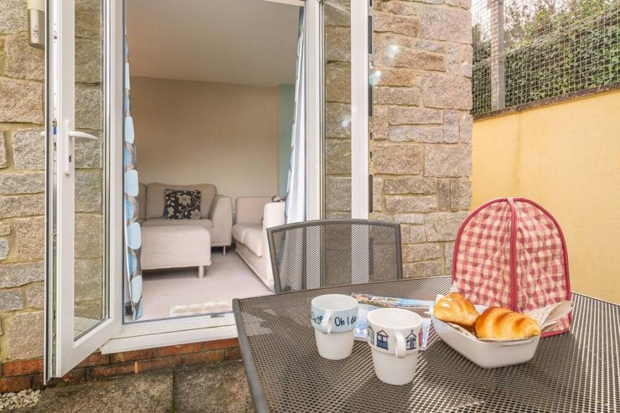 A fabulous pet friendly holiday home, a few minutes’ walk from a private beach.