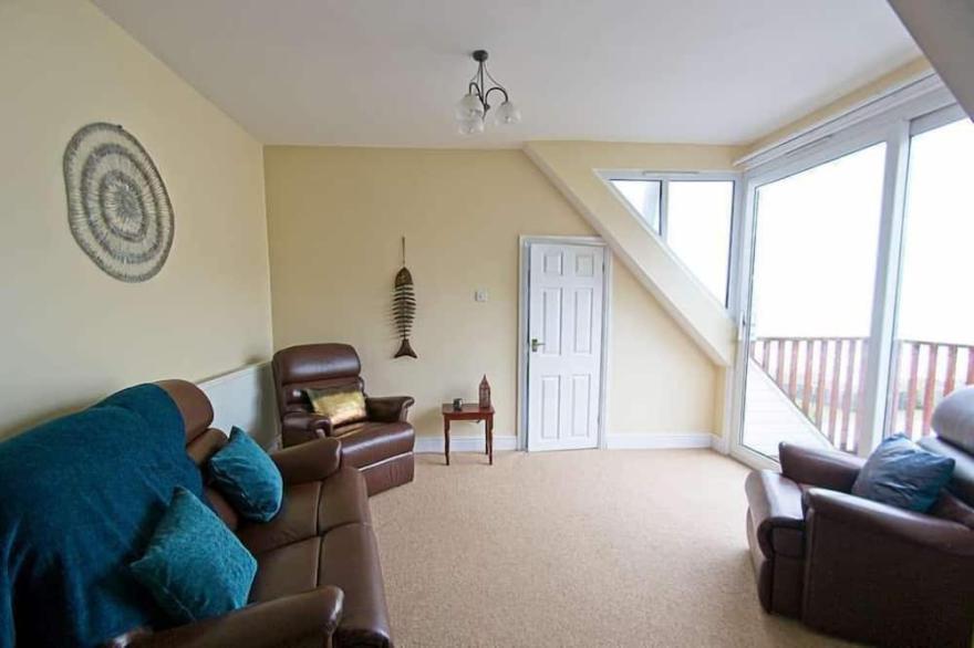 A  2-bedroom seafront apartment in a large detached property on seafront