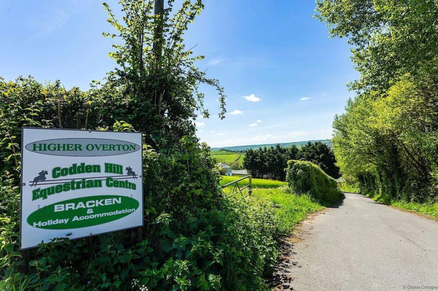 BISHOPS TAWTON SNOWDROP COTTAGE | Hot Tub available - sleeps 6 guests  in 3 bedrooms