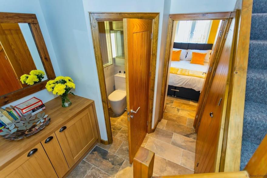 BISHOPS TAWTON SNOWDROP COTTAGE | Hot Tub available - sleeps 6 guests  in 3 bedrooms