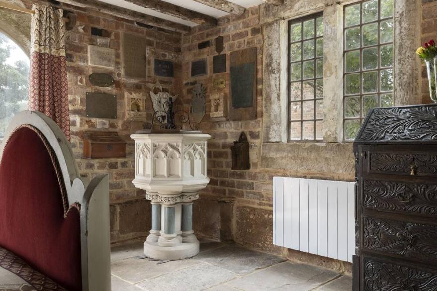 Exposed timbers, a feature stone fireplace, flagstone and oak floors – The Chapel has a wealth of pe