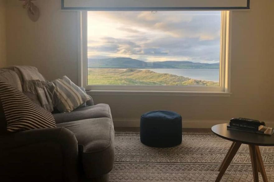 Family Home with stunning beach and mountain views.