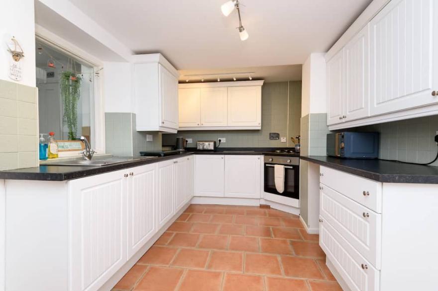 Large family property with parking. Close to Looe town centre.