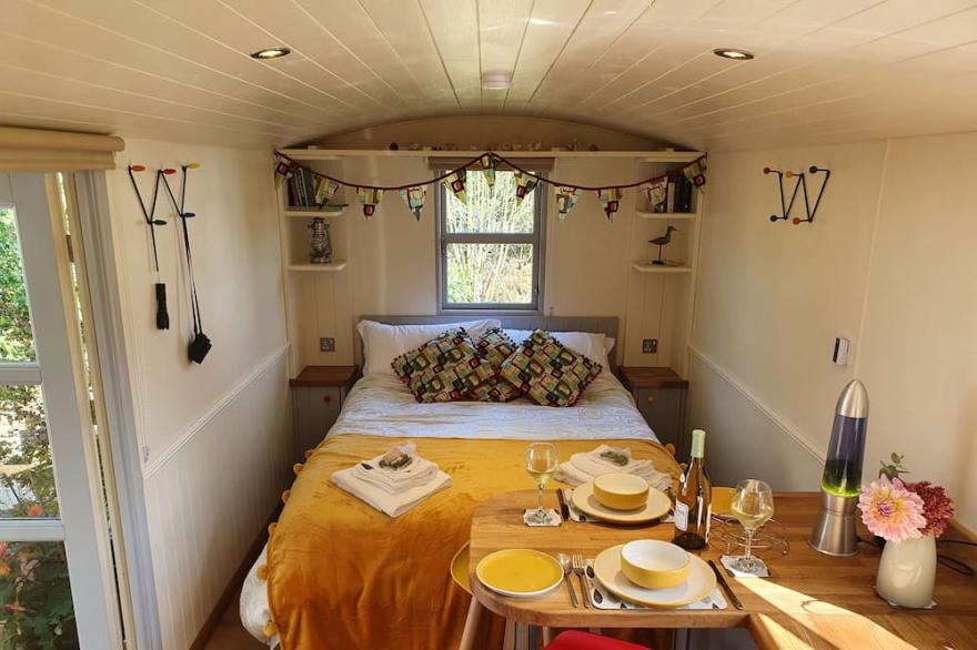A beautiful new shepherds hut that sits perfectly hidden away with a wonderful view of the Norfolk c