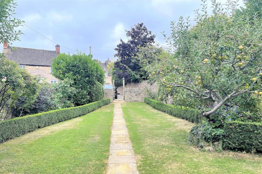Roseleigh Cottage in the heart of Stow-on-the-Wold with parking for 2 cars.