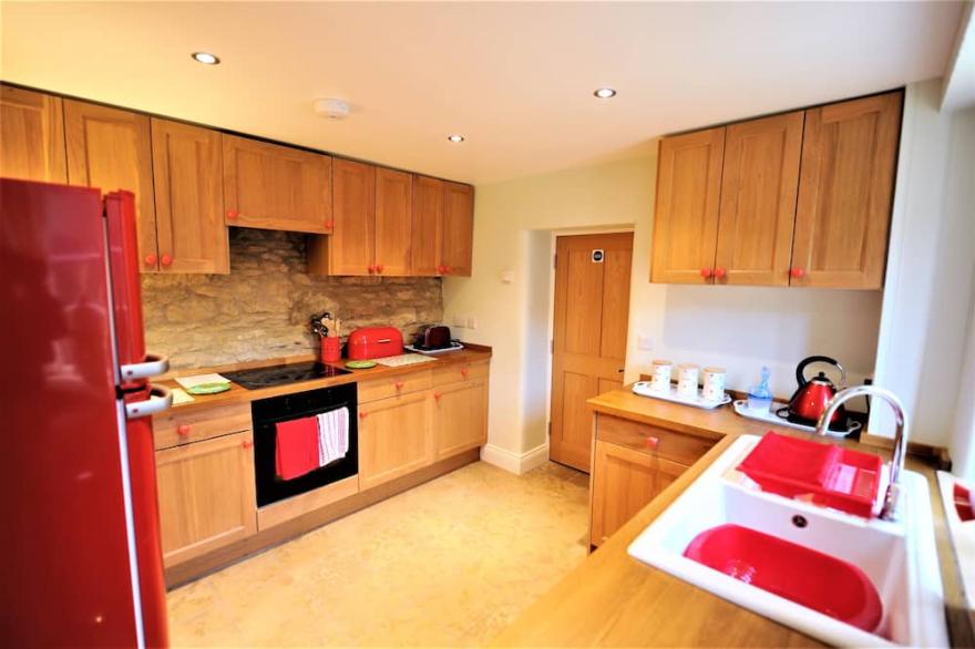 Roseleigh Cottage in the heart of Stow-on-the-Wold with parking for 2 cars.