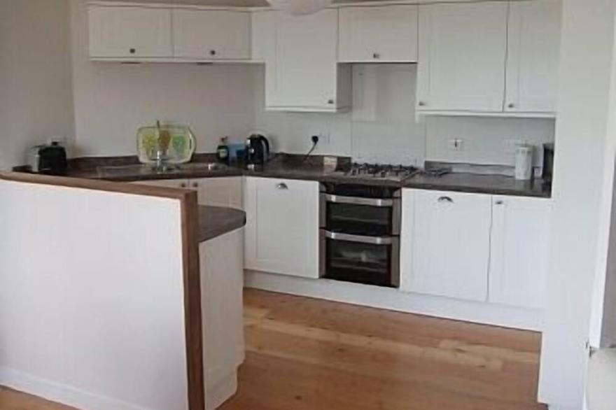 A seafront holiday home with panoramic views of Cowes Harbour and the Solent.